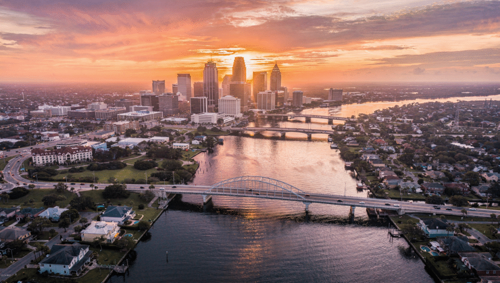 Aerial view of downtown skyline and St. Johns River showing what living in Jacksonville Florida looks like